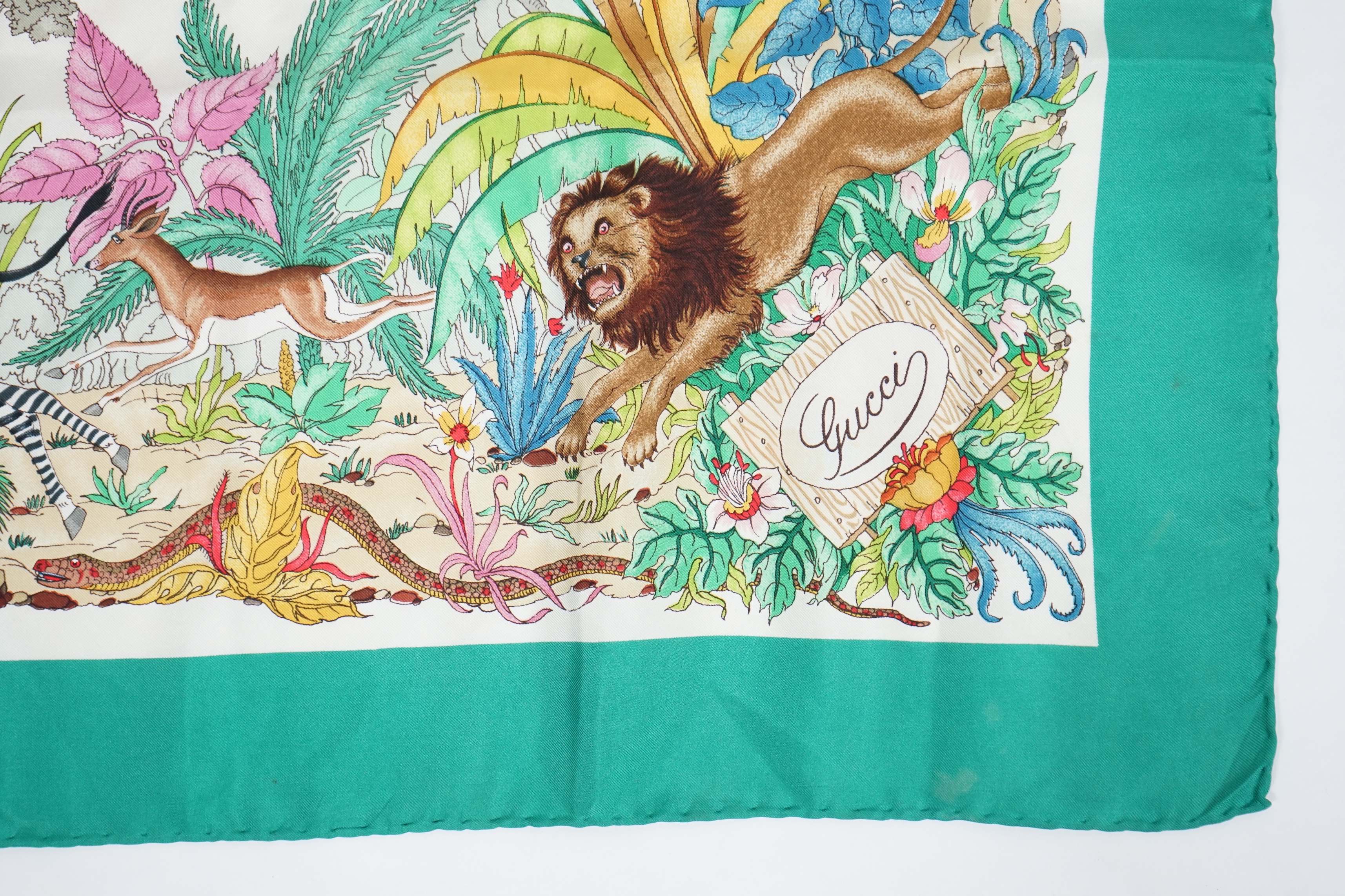 A Gucci 'Jungle' silk scarf, signed V. Accorneroa, 89cm x 89cm